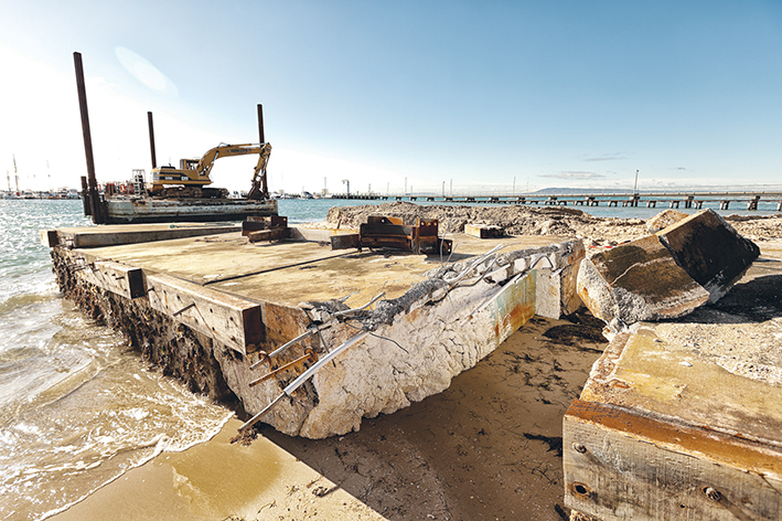 Breaking up: The broken concrete and polystyrene foam wave attenuator on the beach at Blairgowrie marina. Picture: Yanni