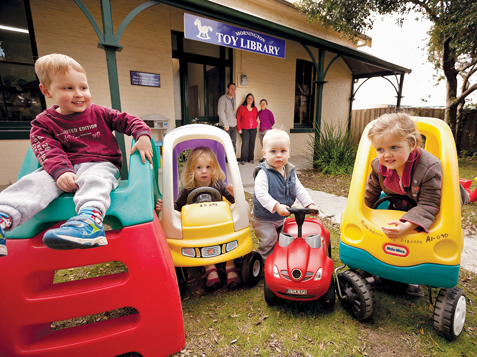 Toy riders: Hudson, Molly, Marion and Mitchell with toy library staff Mary, Jude and Andrew Park. Picture: Yanni