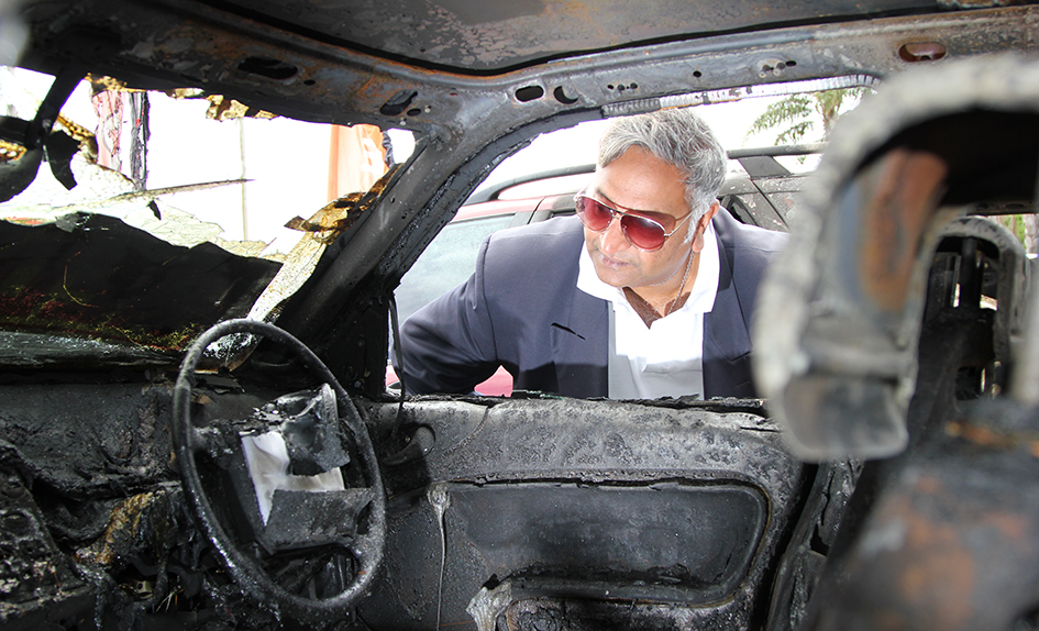 Burnt out: Longbeach Autos owner Gerry Marciny, above, inspects one of the cars destroyed in Saturday’s blaze. Picture: Cameron McCullough