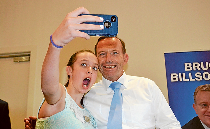 Last chance to see?: Mornington Peninsula Shire’s Young Citizen of the Year Sarah Berry of Mt Eliza, left, took a selfie shot with Prime Minister Tony Abbott at Frankston RSL last Thursday.