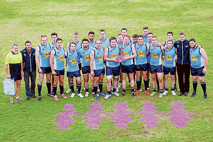 Message clear: The team shows off the Pink Lady stencils on the grass. Pictures: Defence.