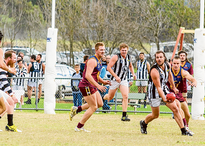 Milestone match: Luke Herrington, pictured with the pill, played his 150th game for Crib Point at the weekend. Picture: Barb Ross
