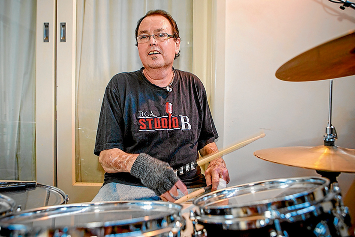 The beat goes on: John Wells has defied the odds to survive throat cancer and is back on the road starring in tribute shows to Roy Orbison and The Eagles. Pic: Gary Sissons