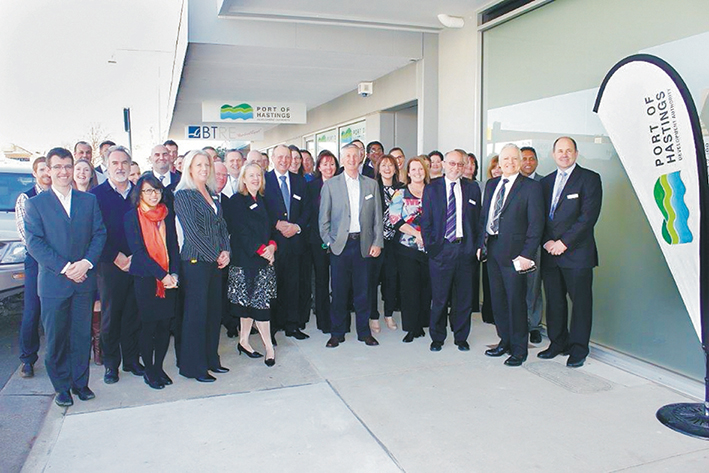 Boom times: Less than one year ago the expanding team of staff at the Port of Hastings Development Authority was celebrating the leasing of new offices in High St, Hastings. They were joined by Hastings MP Neale Burgess (who unveiled a plaque inside the offices), standing third from right with the authority’s CEO Mike Lean. This week staff numbers are down to 14 and most of the office space will go unused. Picture: Gary Sissons