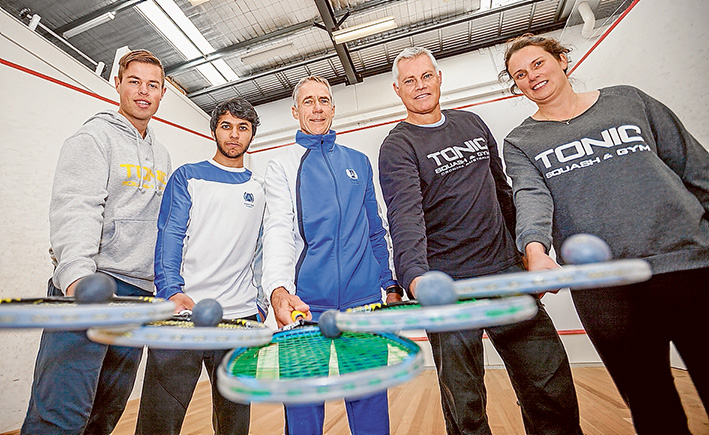 World class: Former number one world squash player Geoff Hunt has brought his knowledge and skills to Dromana last week, inspiring young players at the Tonic courts. Hunt, in blue, is flanked by Zac Alexander, left, Qatar number one player Abdulla Al Tamimi, Rod Martin and Amelia Martin. Picture: Yanni
