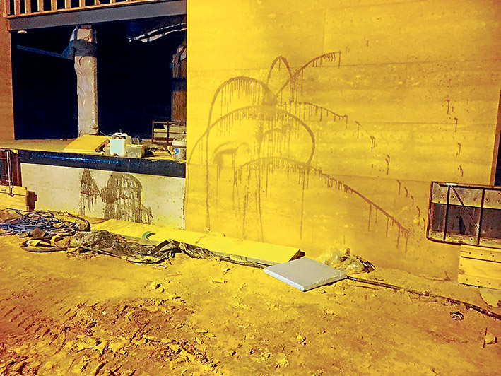 Vandalism spree: A police photograph of oil sprayed against the unfinished wall at the new Somerville Secondary College on Friday night.