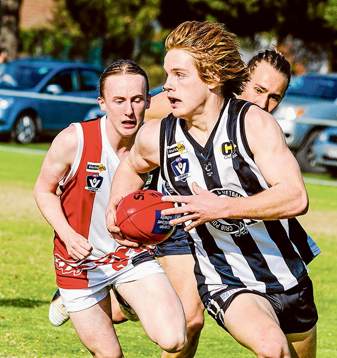 Magpie flies: Under 19s player Nick Rutherford leads the charge against Devon Meadows. Picture: Barb Ross