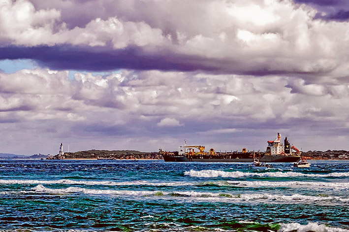 Flashback: It’s 2008 and the Dutch dredger the Queen of the Netherlands works in The Heads to remove rock to allow ships of 14 metres draft to enter Port Phillip. Picture: Yanni