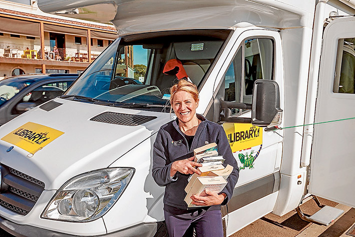 Books not tourists: The shire has leased a campervan to replace the mobile library bus as it undergoes supersizing at a cost of $285,000. Librarian Veronica Wright at Mt Martha on Friday. Picture: Yanni