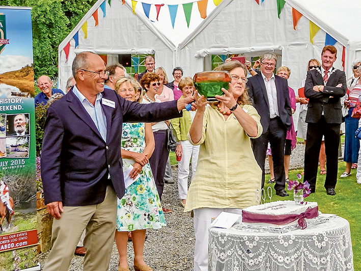 Eight decades: Shire councillor and Dromana resident Graham Pittock presents a green bowl to Barbara Grubb of Dromana House in Ireland at the 800th anniversary of the FitzGerald family occupation of the property. Picture supplied