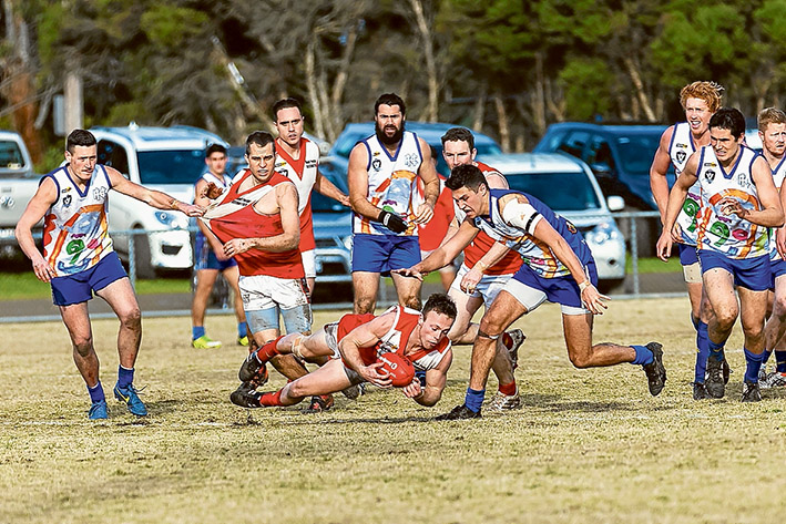 Four quarter effort: Red Hill got down and dirty to get up over Hastings and keep its Nepean League finals chances alive. Picture: Andrew Hurst