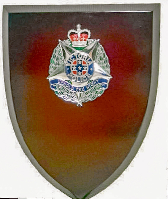 Personal value: The Ty-Eyre plaque stolen in the raid was awarded to Lloyd Smith for helping police investigate the brutal slaying of two young constables.