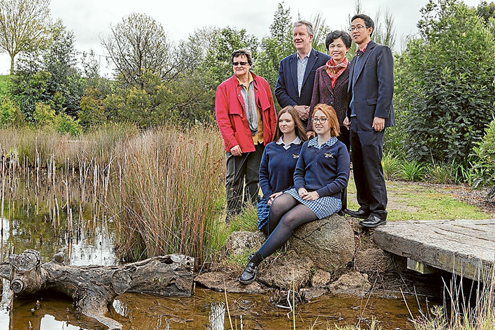 Water savings: Cecelia Witton and Lance Lloyd of the Western Port Biosphere at the Watson Creek water stewardship project with Chinese delegates Zhou Fengqi and Zhu Donglin and Somerville Secondary College students Sarah Murray and Chloe Field. Picture: Gary Sissons