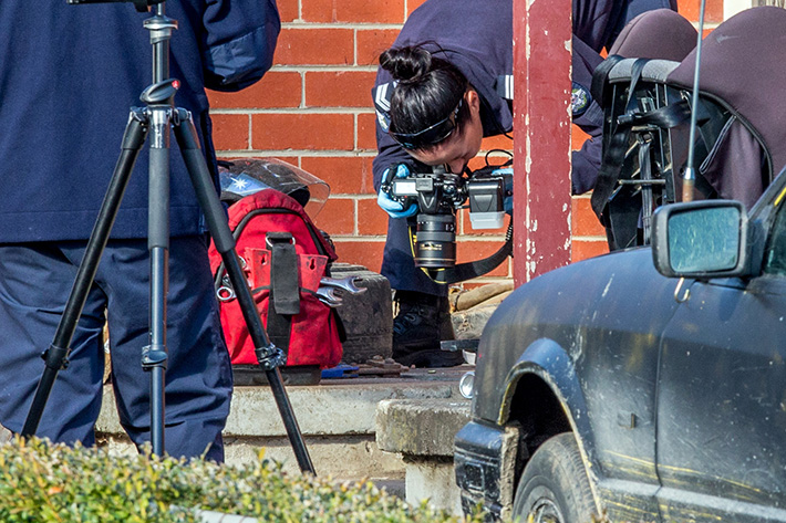 Home Invasion Shooting Hastings. A home invasion and shooting happened at 51 Spring St Hastings. Photo: olice taking photo's of what appears to be a .202 shell at the front door of the house in Spring St Hastings.