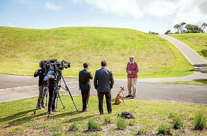 Cull anger: John Henshaw and his dog Izzy being filmed by Melbourne TV stations at the RACV resort in Cape Schanck last Friday afternoon. RACV management in Melbourne has said the cull will not occur. Picture: Yanni