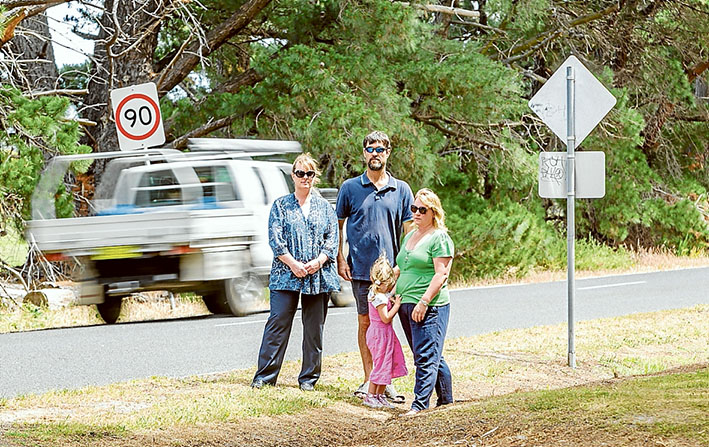 Too fast and too furious: Shelley and Robin King, Leonie Clark and daughter Gwen, want the speed limit on Davies Rd, Bittern, cut to possibly save lives. Left: the latest car to leave the road leading to the Navy’s training base, HMAS Cerberus. Pictures: Yanni