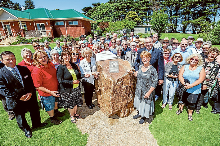 Stop and smell the roses: Garden designer Barry Johnson at the award presentation with World Federation of Rose Societies vice-president Paul Hains, volunteer Jill Hardy, World Federation of Rose Societies president Kelvin Trimper, Cr Anne Shaw and deputy mayor Bev Colomb. Picture: Yanni