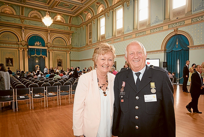 Job well done: Wayne Etcell and partner Dawn Tonge at Government House after receiving the Metropolitan Volunteer of the Year – Dame Elisabeth Murdoch Award.