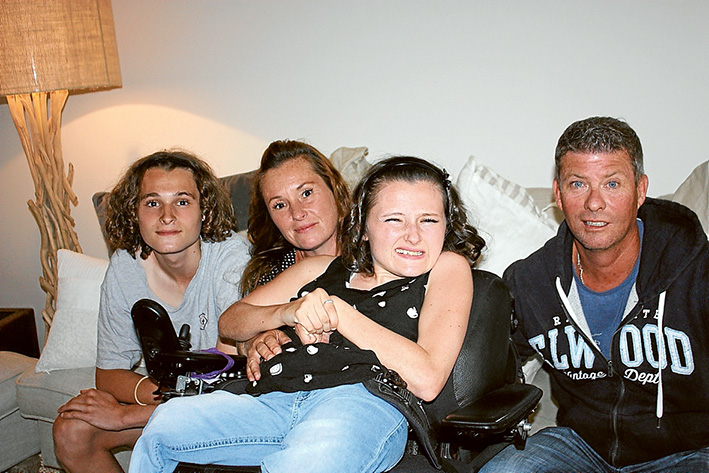 Appealing: Ethan, Fiona and Maygan Garland with Glenn Browne, who is about to take 1000 steps to bolster an appeal to raise money for the family to have wheelchair-friendly vehicle.