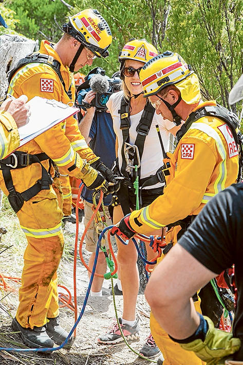 Members of Frankston SES with the dog Mailey, who started the drama by jumping down the cliff, and a friend of the rescued woman.