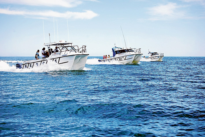 Fleet addition: The Paul Darbyshire III in the foreground with other rescue boats off Mornington after its launch.