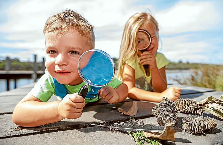 Eye spy: Six year old Ruby Wilson and her two-a-half-year-old-brother Lachlan do some bush detecting at Balcombe estuary. Picture: Yanni