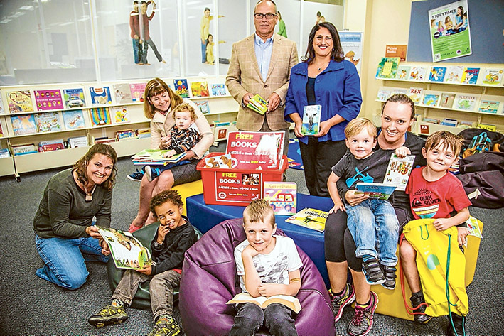 Reading ready: Mornington Peninsula Shire Mayor Cr Graham Pittock with Cr Antonella Celi, chair of the Peninsula Reads Committee, Lorni Landrigan with sons Brax and Ryder, Ben Felder, Kate and Lucas Masterton-Bojang, Heather and Jaxon Taylor at Rosebud library.
