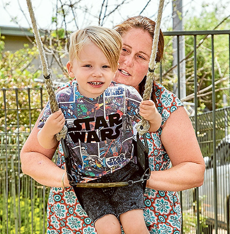 Flying high: Kirsten plays with Banjo on the swing at Biala. Picture: Gary Sissons