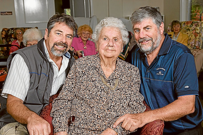 Happy birthday mum: Brothers Phillip and Ian with mum Dorothy Johnson at her centenary celebration at Shoreham House. Picture: Gary Sissons