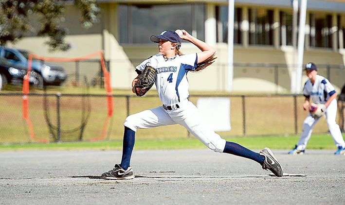 Batter beware: Genevieve Beacom doing what she loves: pitching – hard – against the boys.