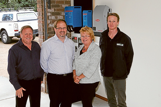 Powered up: The team behind the manufacture and marketing of a battery designed to store electricity on which houses can be run overnight or when solar power is unavailable, from left, Max Coulthard, David Treanor, Margaret Harrison and David Jung. Below, six of the lithium battery packs can power a house for about three days.