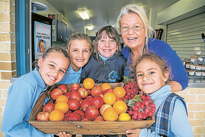 Yum yum: Canteen manager Mandy Biggins, herewith Francesca, Lilka, Brigitte and Saskia, says Kunyung pupils look forward to meal times now. Picture: Gary Sissons