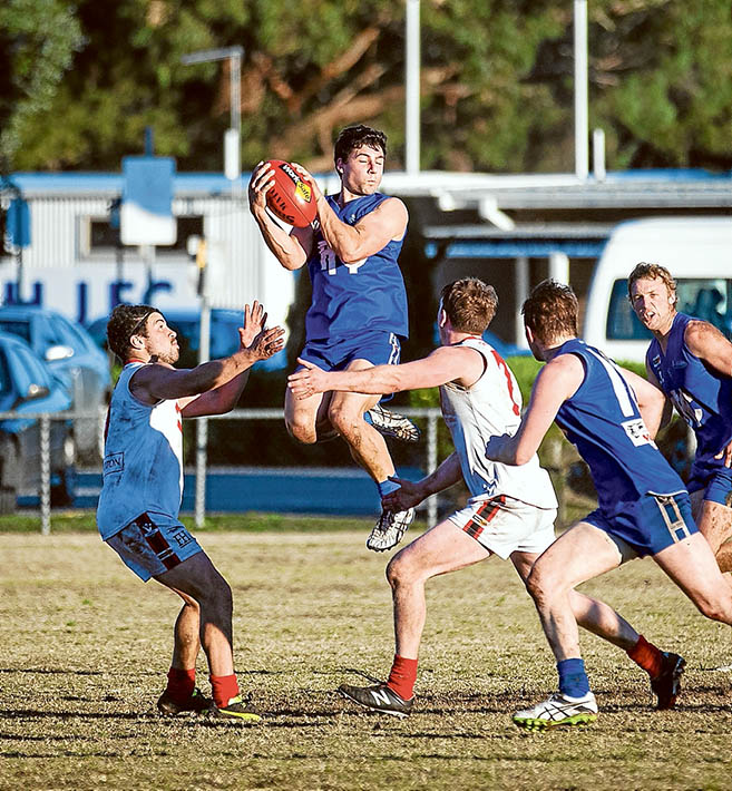 It’s mine!: Despite the home ground advantage, Hastings went down by 26 points against Red Hill. Picture: Andrew Hurst