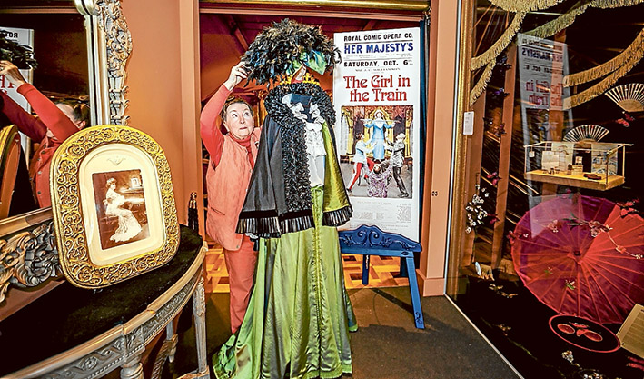 Memories: Costume mistress Heather Peake shows off some of the period fashions on show at the Beleura musical. Picture: Yanni