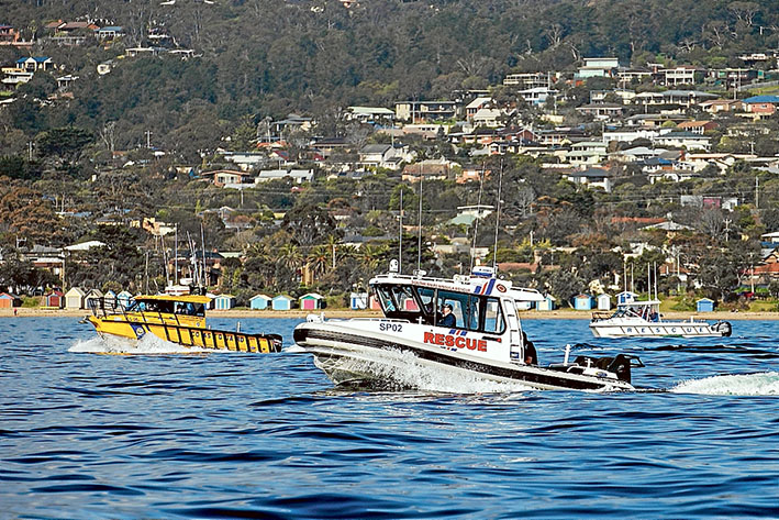 Train as you play: Search and rescue boats motor out from Safety Beach to begin the mock training exercises. Pictures: Gary Sissons