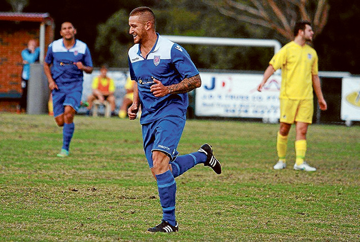 Winning grin: Langy striker Koray Suat.