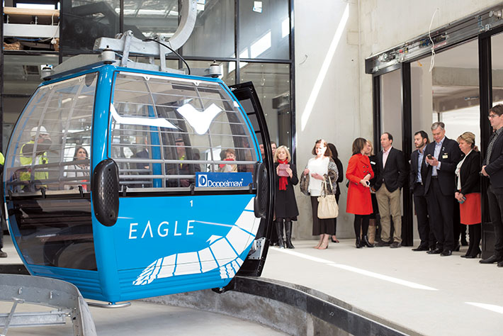 Top station: Invited guests take a close up look at one of the newly named Eagle gondolas which will soon be running up and down Arthurs Seat. Picture: Jarryd Bravo