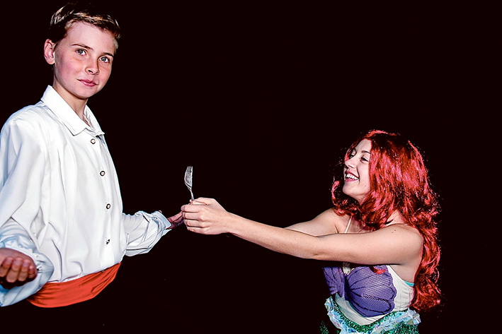 Magical kingdom below: The young mermaid Ariel, right, longs to leave her ocean home to live in the world above. But first she’ll have to defy her father King Triton, make a deal with the evil sea witch Ursula, and convince Prince Eric, left, that she’s the girl with the enchanting voice.
