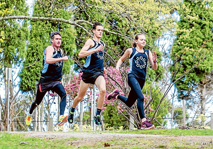 On track: Nicholas Lynch (left) with 16-year-old son Brodie and 13-year-old Abbey Brady. Picture: Yanni 