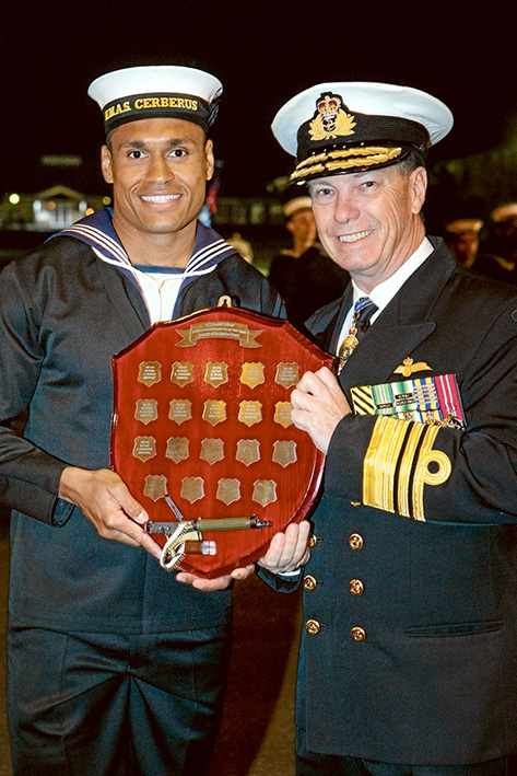 Well done: Seaman Star Marine Technician Jeff Andrews is congratulated by Chief of Navy, Vice Admiral Tim Barrett, AO, CSC, RAN.