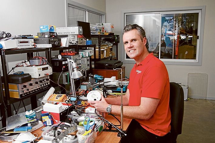 David Clerk and the security light that includes a camera, microphone and speaker.