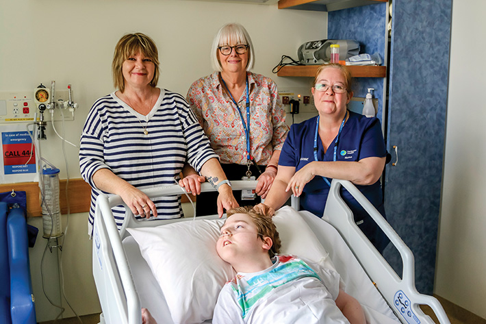 Fund run: A fun run against an historic locomotive is being held by Mt Eliza Rotary Club to raise money for Frankston Hospital’s paediatric ward. Caleb Tischer, in one of the beds bought with money raised from last year’s fun run, is pictured with his mother Lynn, left, paediatric ward nurse unit manager Helen Hutchins and nurse Leanne Hill.