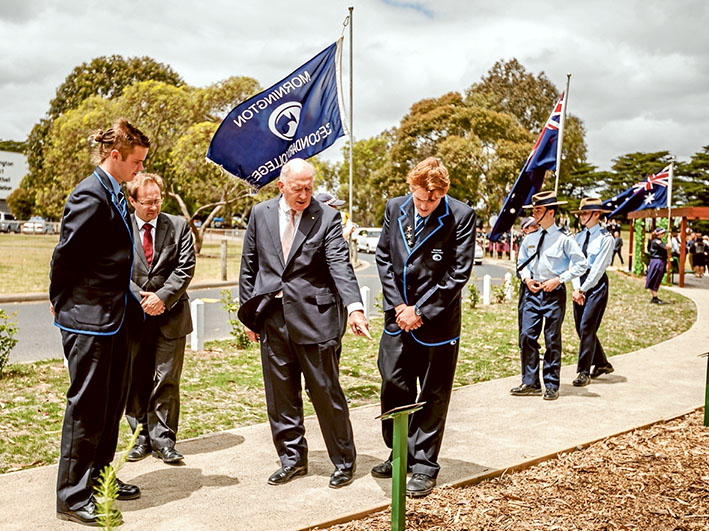 THE Governor-General Sir Peter Cosgrove is shown the path at the centre of a new avenue of honour that has been planted at Mornington Secondary College. Pictures: Yanni