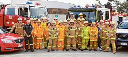 Call to action: A Mornington firefighter sprints back to the truck as flames engulf a building, below; the Mornington fire brigade today, above; and the original Mornington fire station, below.